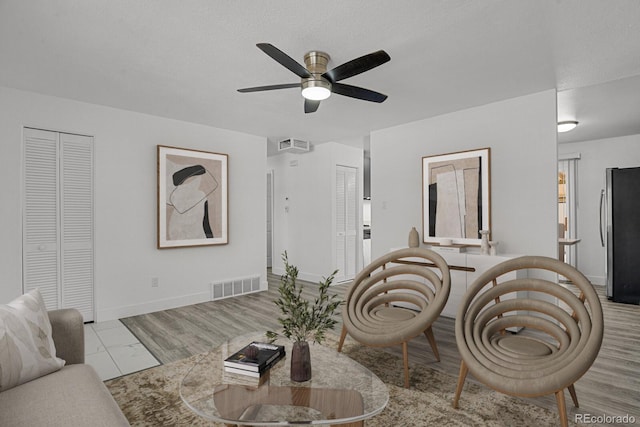 8381 Vine St, Denver, CO 80229 - living area featuring a ceiling fan and baseboards