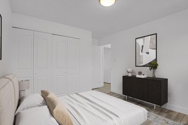 8381 Vine St, Denver, CO 80229 - bedroom featuring light wood-style flooring and a closet