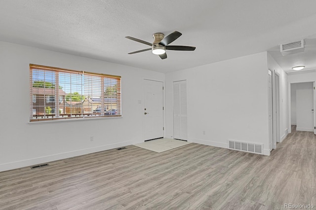 8381 Vine St, Denver, CO 80229 - spare room with a ceiling fan, light wood-type flooring, and a textured ceiling