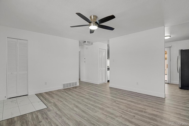 8381 Vine St, Denver, CO 80229 - unfurnished living room with a ceiling fan and wood finished floors