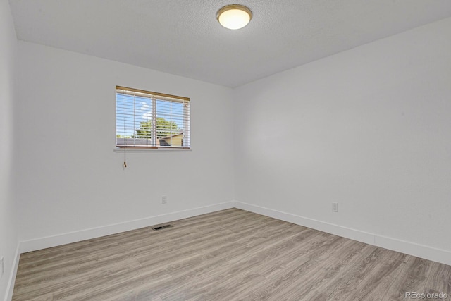 8381 Vine St, Denver, CO 80229 - unfurnished room featuring light wood-style floors and a textured ceiling