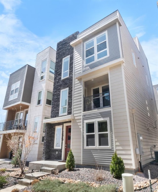 11918 Mountview Ln, Broomfield, CO 80021 - view of front of property with a balcony and stone siding