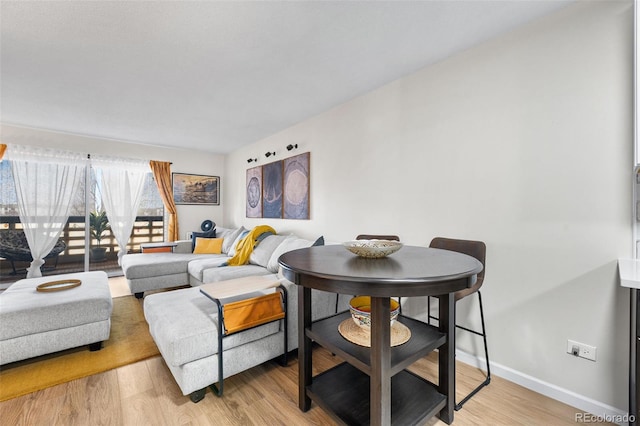 495 S Dayton St Unit 1C, Denver, CO 80247 - living room with light wood-type flooring and baseboards