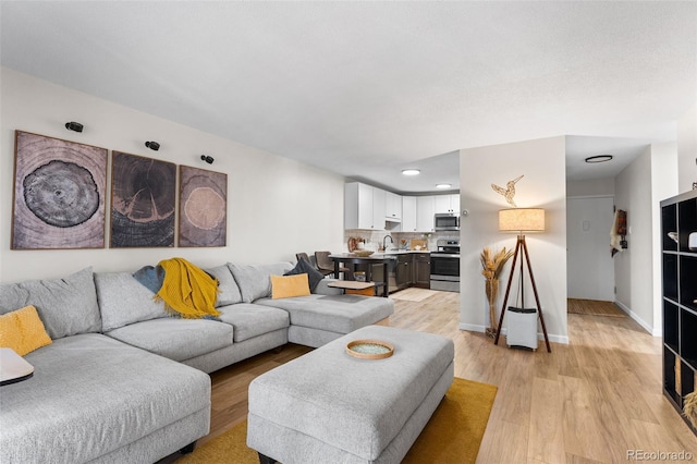 495 S Dayton St Unit 1C, Denver, CO 80247 - living room with recessed lighting, light wood-type flooring, and baseboards