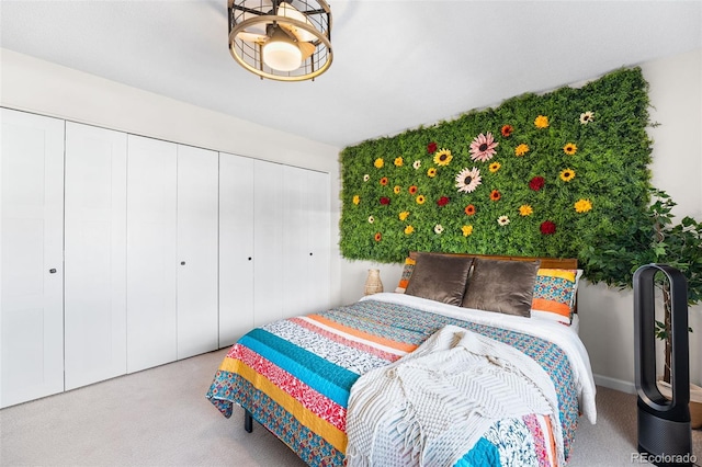 495 S Dayton St Unit 1C, Denver, CO 80247 - bedroom with a closet, baseboards, and carpet floors