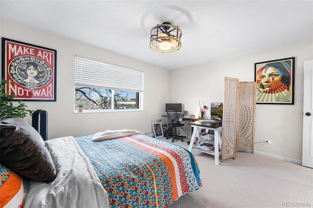 495 S Dayton St Unit 1C, Denver, CO 80247 - bedroom featuring baseboards and carpet