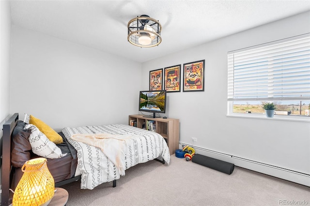 495 S Dayton St Unit 1C, Denver, CO 80247 - carpeted bedroom with baseboard heating