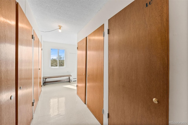 495 S Dayton St Unit 1C, Denver, CO 80247 - corridor with a textured ceiling