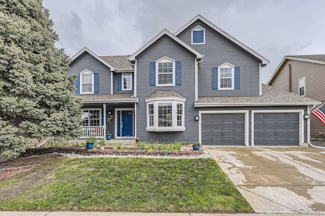 8862 Chestnut Hill Ln, Highlands Ranch, CO 80130 - traditional-style home with covered porch, concrete driveway, a front lawn, an attached garage, and roof with shingles