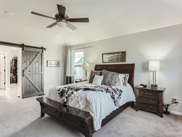 8862 Chestnut Hill Ln, Highlands Ranch, CO 80130 - carpeted bedroom with a barn door, baseboards, and a ceiling fan