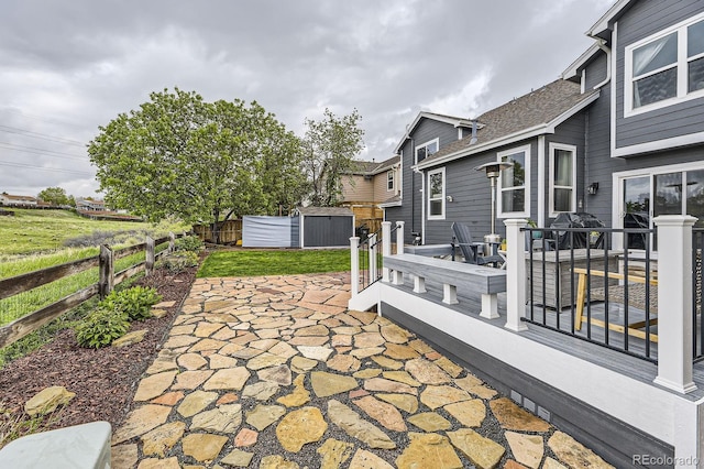 8862 Chestnut Hill Ln, Highlands Ranch, CO 80130 - view of patio featuring a storage shed, fence, an outbuilding, and a wooden deck