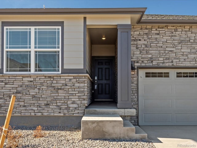 doorway to property featuring a garage