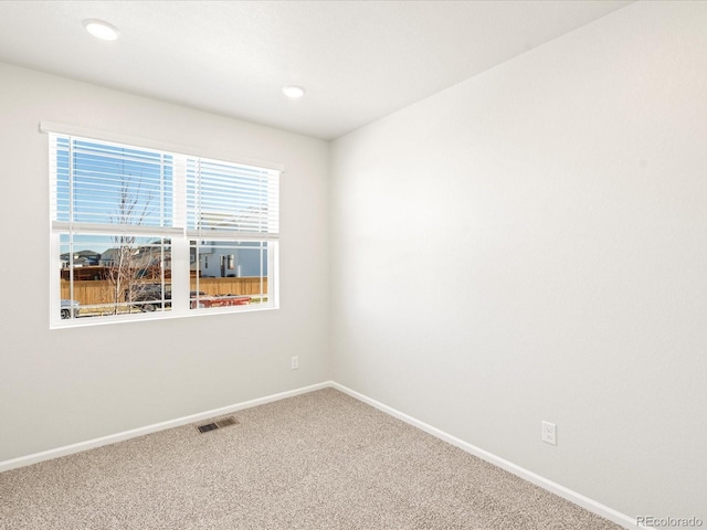 empty room featuring carpet flooring