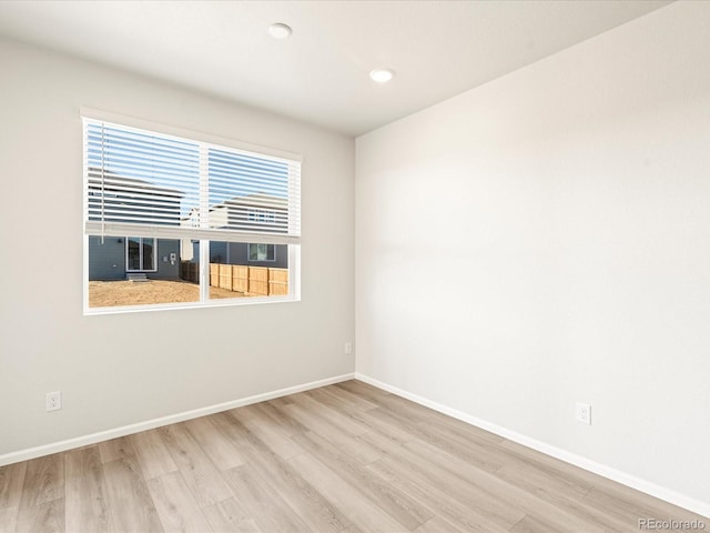 unfurnished room featuring light hardwood / wood-style flooring