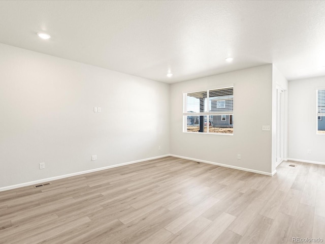 empty room with light wood-type flooring