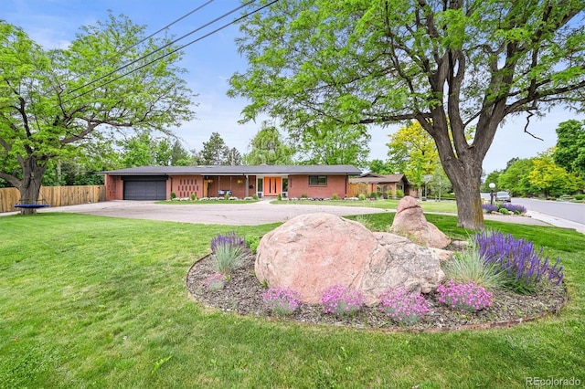 5200 W Rowland Ave, Littleton, CO 80128 - ranch-style house featuring concrete driveway and a garage