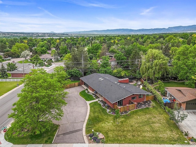 5200 W Rowland Ave, Littleton, CO 80128 - drone / aerial view of a mountainous background and a heavily wooded area