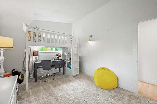 5200 W Rowland Ave, Littleton, CO 80128 - bedroom featuring carpet flooring, an office area, baseboards, and a towering ceiling
