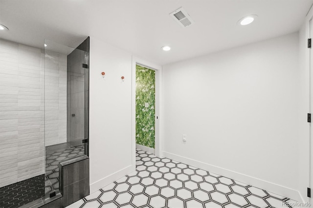 5200 W Rowland Ave, Littleton, CO 80128 - interior space featuring recessed lighting, a tile shower, baseboards, and tile patterned floors