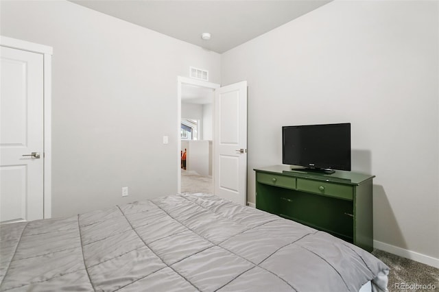 bedroom with visible vents, baseboards, and carpet flooring