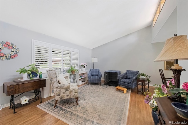 6040 Taft Ct, Arvada, CO 80004 - living room with wood finished floors, vaulted ceiling, and baseboards