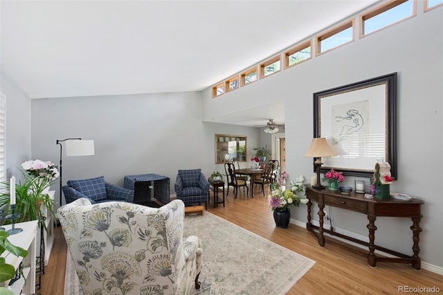 6040 Taft Ct, Arvada, CO 80004 - living area with healthy amount of natural light, light wood-type flooring, a ceiling fan, and baseboards
