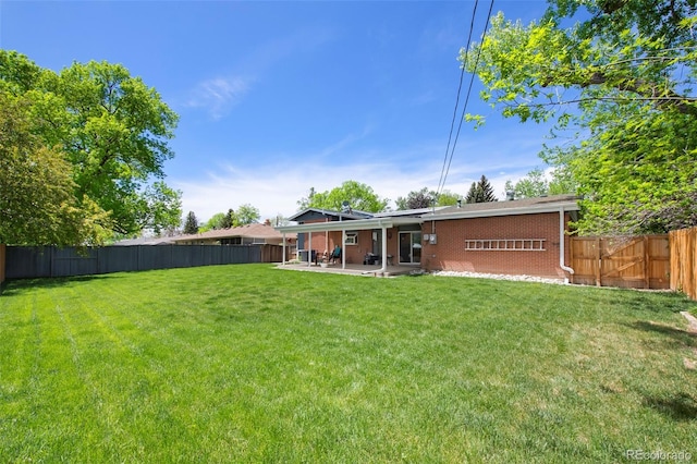 6040 Taft Ct, Arvada, CO 80004 - back of house featuring a patio area and brick siding