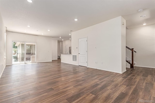 14065 Harrison St, Thornton, CO 80602 - unfurnished living room with dark wood-style flooring, recessed lighting, and stairs