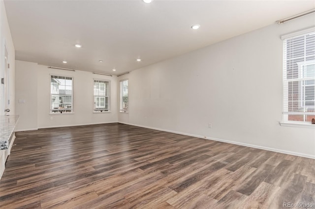 14065 Harrison St, Thornton, CO 80602 - spare room with dark wood-style flooring and recessed lighting