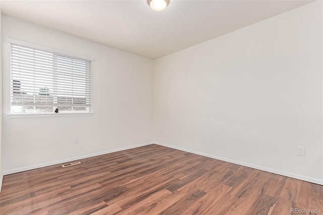 14065 Harrison St, Thornton, CO 80602 - unfurnished room featuring wood finished floors and baseboards