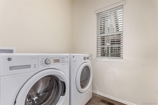 14065 Harrison St, Thornton, CO 80602 - laundry area with washer and dryer and baseboards