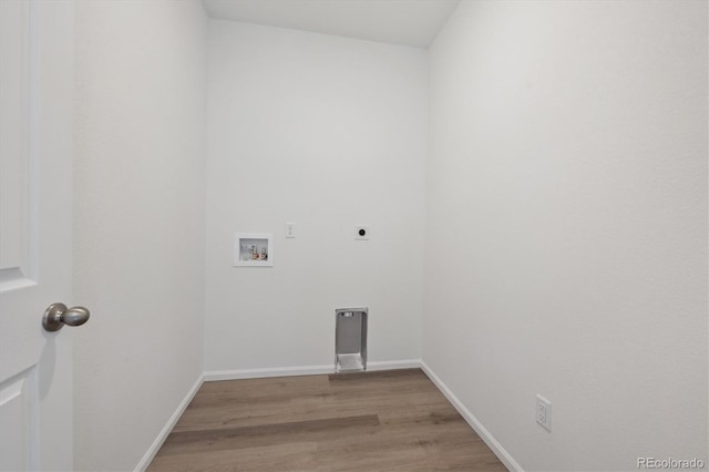 laundry area featuring washer hookup, light hardwood / wood-style floors, and hookup for an electric dryer