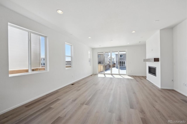 unfurnished living room featuring light hardwood / wood-style flooring