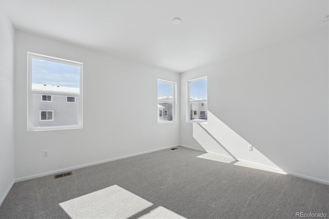 view of carpeted spare room