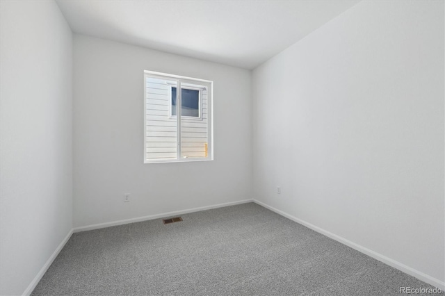 empty room featuring carpet flooring