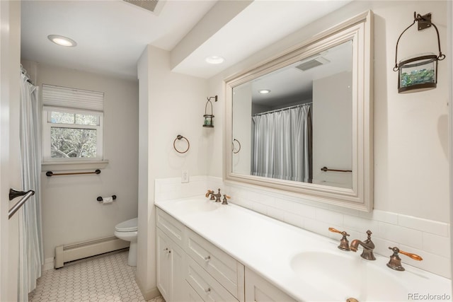 full bath with a baseboard heating unit, toilet, double vanity, and recessed lighting