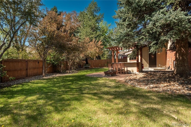 view of yard with a fire pit, a patio, and a pergola