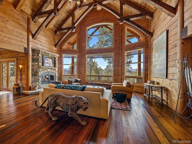 29548 Sunset Trl, Pine, CO 80470 - living room featuring plenty of natural light, wooden walls, wooden ceiling, high vaulted ceiling, and wood-type flooring