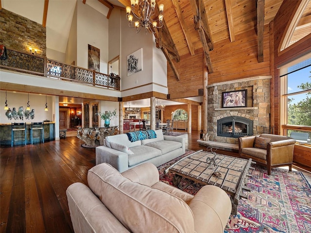 29548 Sunset Trl, Pine, CO 80470 - living area featuring high vaulted ceiling, hardwood / wood-style flooring, a notable chandelier, and wood ceiling