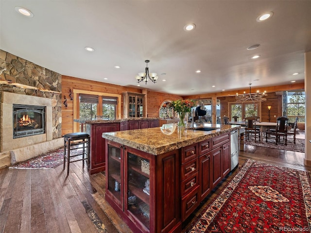 29548 Sunset Trl, Pine, CO 80470 - kitchen featuring a sink, a notable chandelier, dark wood-type flooring, and recessed lighting