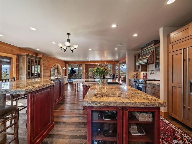29548 Sunset Trl, Pine, CO 80470 - kitchen with a healthy amount of sunlight, a chandelier, high end stove, and recessed lighting