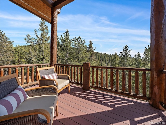 29548 Sunset Trl, Pine, CO 80470 - wooden terrace featuring a view of trees