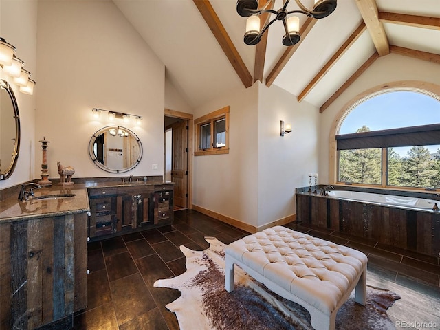 29548 Sunset Trl, Pine, CO 80470 - bathroom featuring vanity, beamed ceiling, a garden tub, high vaulted ceiling, and a notable chandelier