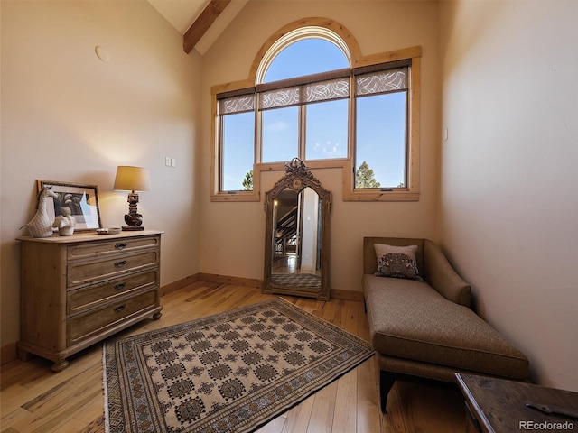 29548 Sunset Trl, Pine, CO 80470 - living area featuring light wood-type flooring, vaulted ceiling with beams, and baseboards
