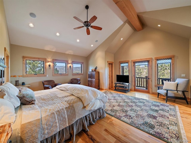 29548 Sunset Trl, Pine, CO 80470 - bedroom with multiple windows, wood finished floors, recessed lighting, and access to exterior