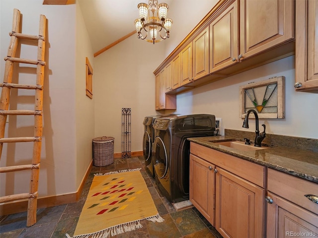 29548 Sunset Trl, Pine, CO 80470 - washroom featuring separate washer and dryer, cabinet space, stone tile floors, and a sink