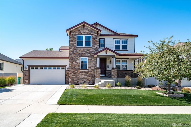 craftsman inspired home featuring a garage and a front yard