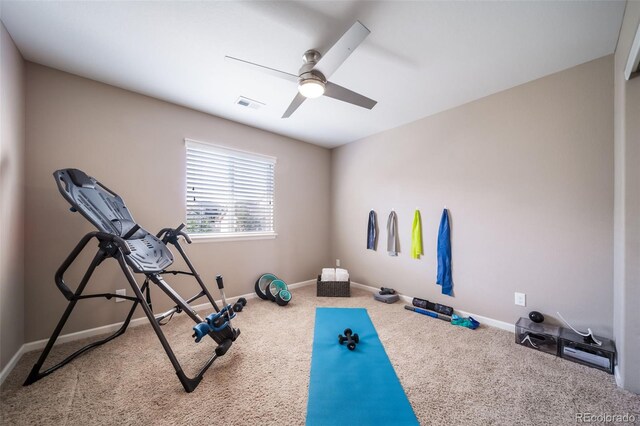 exercise room with ceiling fan and carpet floors