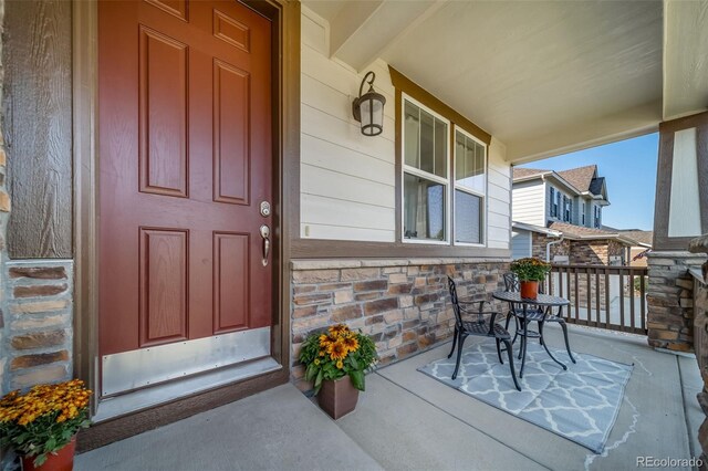 entrance to property with a porch