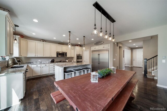 dining space with sink and dark hardwood / wood-style floors